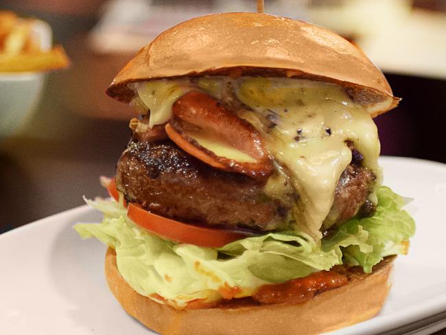 French Coulommiers Truffle Brie Angus Burger for Friday Feed Premium Black Angus patty with Truffle Brie Cheese, housemade Truffle Mayonnaise,housemade Tomato Relish, Bacon, Fresh Tomato, Fresh Lettuce and Onion on a Milk bun.