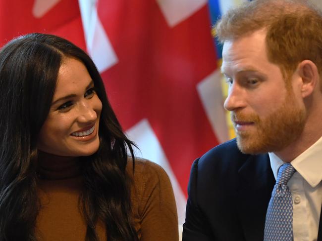 LONDON, UNITED KINGDOM - JANUARY 07: Prince Harry, Duke of Sussex and Meghan, Duchess of Sussex gesture during their visit to Canada House in thanks for the warm Canadian hospitality and support they received during their recent stay in Canada, on January 7, 2020 in London, England. (Photo by DANIEL LEAL-OLIVAS  - WPA Pool/Getty Images)