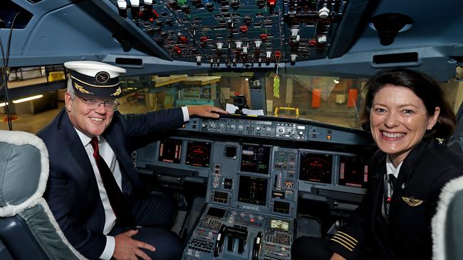 Prime Minister Scott Morrison and Qantas pilot captain Debbie Slade in the cockpit of an Airbus A330 at Qantas Hangar 96 at Sydney Airport on Thursday. Picture: NCA NewsWire/Pool/Dylan Coker