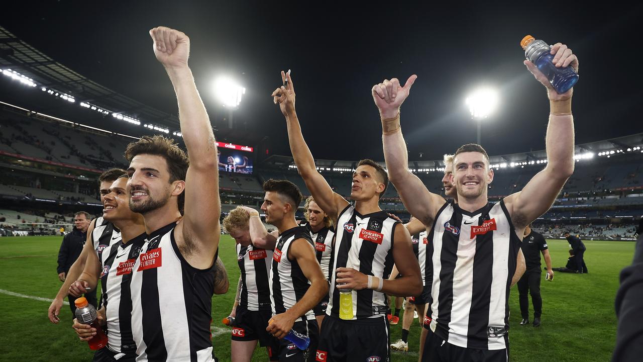 Magpies players celebrate winning at the MCG. Photo by Daniel Pockett/Getty Images.