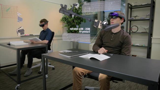 A student studies a hologram image with Microsoft HoloLens. Photo: Saab