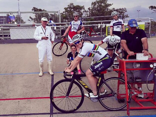 Anna Meares on the track in Rockhampton with local riders and former coach Reggie Tucker.