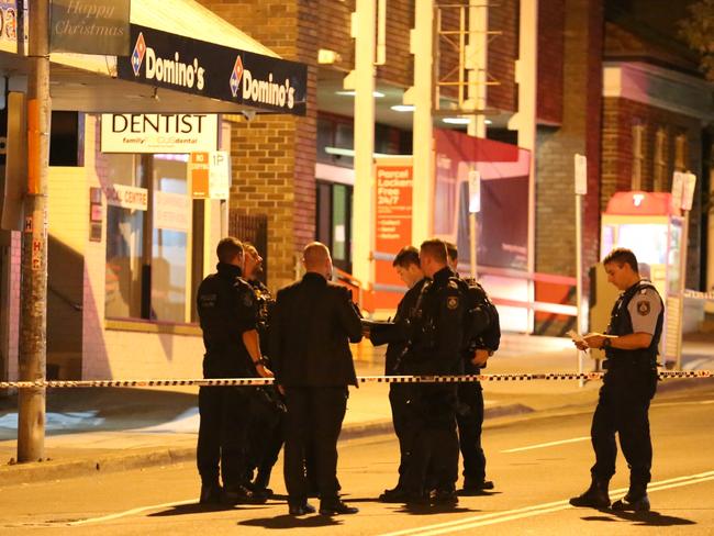 Police outside the Wentworthville Domino's Pizza shop after shooting there in January. Picture: Steve Tyson