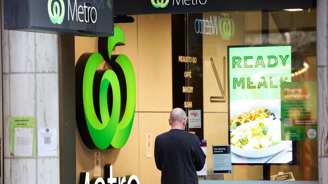 A view of a man seen signing in with QR odes to enter Woolworths in Pitt Street Mall in the CBD during Lockdown, as the Covid-19 cases continue to rise in Sydney. Picture: NCA NewsWire/ Gaye Gerard