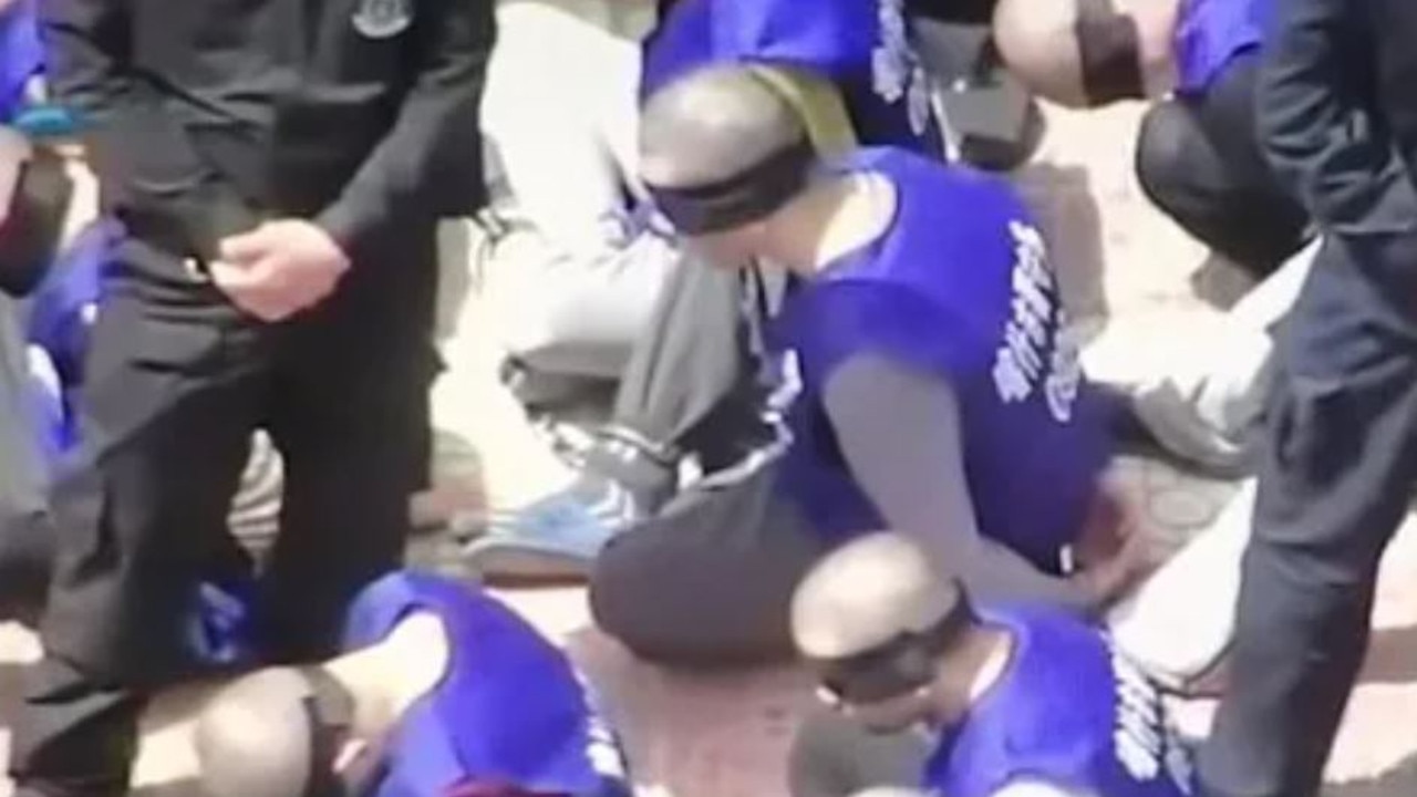 Drone footage captured prisoners shackled and blindfolded in the yard of a ‘re-education’ camp.