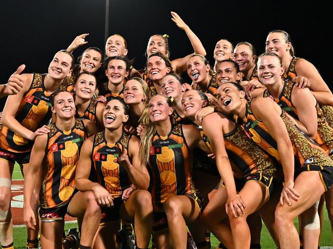 CAIRNS, AUSTRALIA - OCTOBER 24: The Hawks pose for a selfie after winning the round nine AFLW match between Hawthorn Hawks and Narrm (Melbourne Demons) at Cazaly's Stadium, on October 24, 2024, in Cairns, Australia. (Photo by Emily Barker/Getty Images)