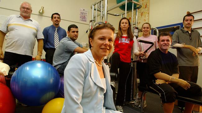 Dr Fiona Wood in 2003 with Bali survivors (from left) Gary Nash, Aaron Cowdery, Stuart Henderson, Tracey Ball, Melinda Kemp, Peter Hughes and Antony Svilicich. Picture: Tony McDonough