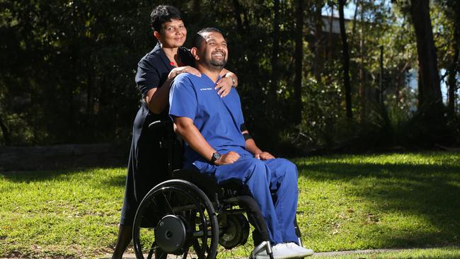 Dr Dinesh Palipana, pictured here with his mother Chithrani, sustained a major spinal cord injury after a car accident in 2010. He is now an ER doctor at Gold Coast University Hospital. Picture: Glenn Hanmpson