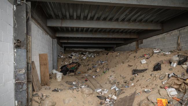 A narcos tunnel uncovered in a warehouse about 80 metres from the United States and Mexican border. The tunnel was concealed behind a secret door. Rubbish can be seen strewn across the floor including food wrappers and water bottles. Picture: Jason Edwards