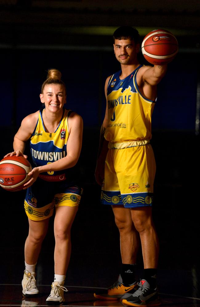 Townsville Flames' Steph Reid and Townsville Heat's Taine Wattie. Picture: Evan Morgan