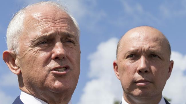 Australian Prime Minister Malcolm Turnbull (left) and Member for Dickson Peter Dutton speak to media in Murrumba Downs, Brisbane, Tuesday, April 3, 2018. Mr Turnbull announced funding for a $150 million upgrade to the Bruce Highway. (AAP Image/Glenn Hunt) NO ARCHIVING, EDITORIAL USE ONLY