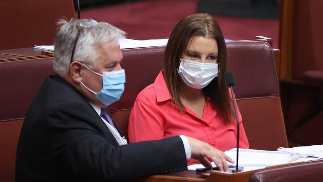 Senators Rex Patrick and Jacqui Lambie work together in Parliament House during Covid. Picture: Gary Ramage