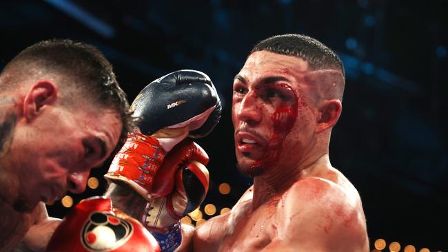 Teofimo Lopez punches George Kambosos during their championship bout. Photo by Al Bello/Getty Images