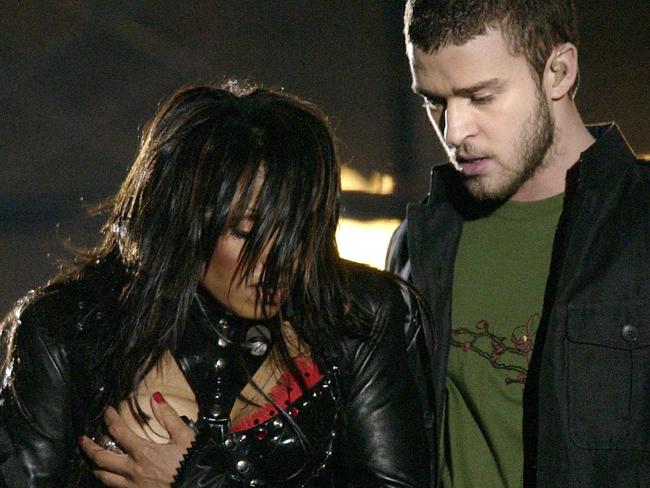 WIRE: FILE - In a Sunday Feb. 1, 2004 file photo, entertainer Janet Jackson, left, covers her breast after her outfit came undone during the half time performance with Justin Timberlake at Super Bowl XXXVIII in Houston. A federal appeals court in Philadelphia threw out out a $550,000 fine issued by the Federal Communications Commission against CBS Corp. Monday, July 21, 2008, for the 2004 Super Bowl halftime show that ended with Janet Jackson's breast-baring 'wardrobe malfunction.'