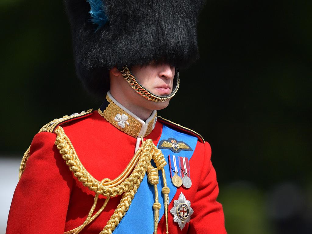 Prince William, Duke of Cambridge on horseback follows Britain's Queen Elizabeth II in a horse-drawn carriage into Horseguards parade. Picture: AFP