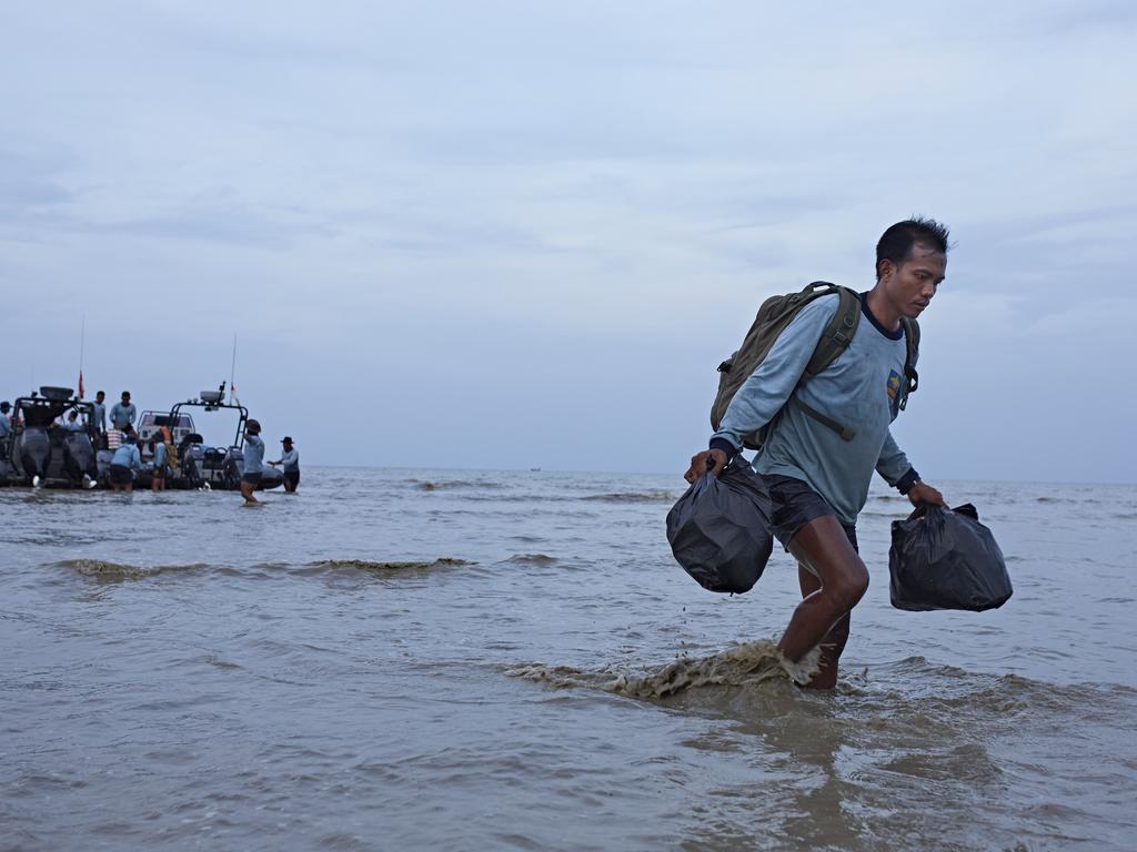 A Navy diver returns to base after a day of searching the wreckage site in Karawang, Indonesia. Picture: Getty