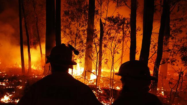 Department of Environment, Land, Water and Planning and CFA crews monitor fires and begin back burns between the towns of Orbost and Lakes Entrance in east Gipplsland. Photo: by Darrian Traynor/Getty Images