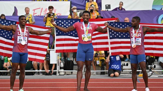 Silver medallist USA's Marvin Bracy (L), gold medallist USA's Fred Kerley (C) and USA's Trayvon Bromell (R) celebrate after the men's 100m final during the World Athletics Championships at Hayward Field in Eugene, Oregon on July 16, 2022. (Photo by ANDREJ ISAKOVIC / AFP)