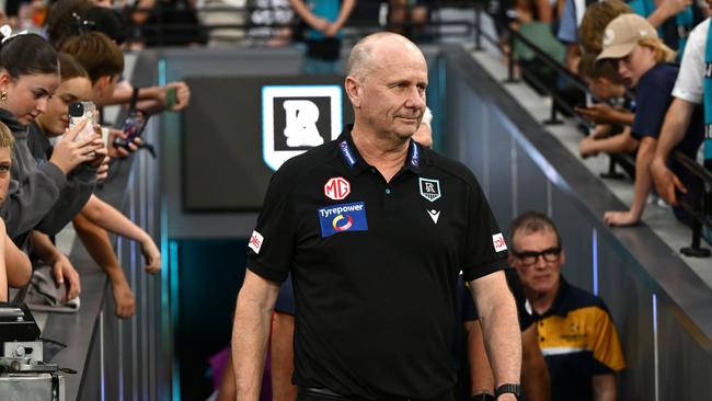 MELBOURNE, AUSTRALIA - MARCH 15: Ken Hinkley the coach of Port walks out onto the field during the round one AFL match between Collingwood Magpies and Port Adelaide Power at Melbourne Cricket Ground, on March 15, 2025, in Melbourne, Australia. (Photo by Quinn Rooney/Getty Images)