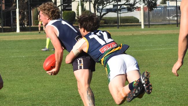 Jacob Coxall tackles a Melton South player. He was the leading goalkicker on the day for the club. Picture: Lake Wendouree Football Club.