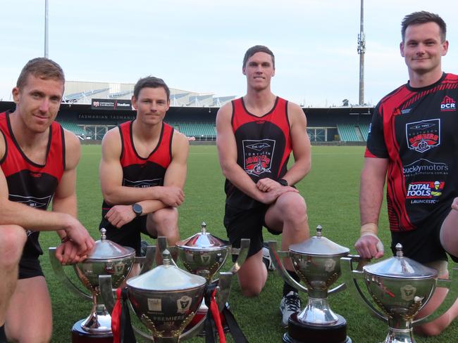 North Launceston stalwarts Brad Cox-Goodyer, Jack Avent, Connor Young and Alex Lee with some of the Bombers' premiership cups. Picture: Jon Tuxworth