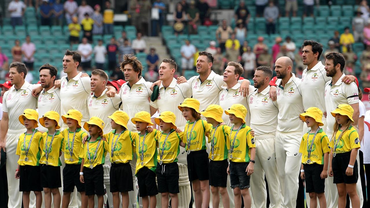 The Australian team stand for the national anthem during day 1 of the Third Test.