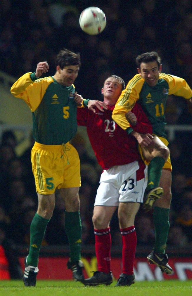 Wayne Rooney sandwiched by Tony Vidmar and Stan Lazaridis on his England debut, against Australia in 2003.