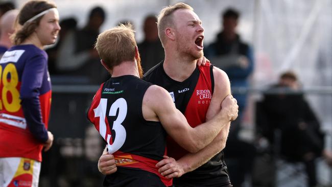 RDFL grand final: Riddell v Diggers Rest: Liam Berry of Riddell (R) celebrates a goal on Sunday September 11th, 2022, in Romsey, Victoria, Australia.Photo: Hamish Blair