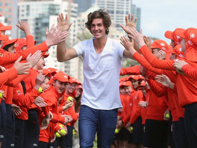 At the Australian Open launch, Thanasi Kokkinakis high fives the ball kids in Birrarung Marr, Melbourne. Picture: Alex Coppel.