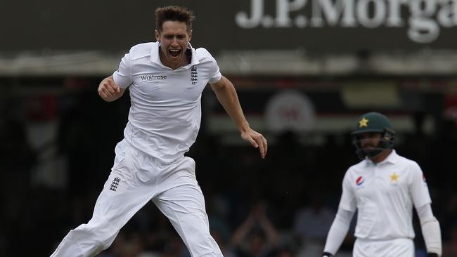 England’s Chris Woakes celebrates taking the wicket of Pakistan’s Shan Masood.