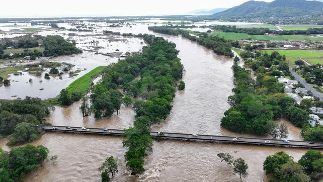 The Barron River in Cairns, Far North Queensland, reached a record flood peak, with roads closed and homes flooded in the catchment area on Sunday, December 17. Picture: Brendan Radke