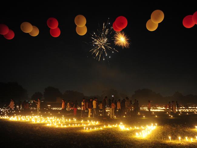 Indian athletes watch fireworks at the Madan Mohan Malviya stadium on the eve of the Hindu festival of Diwali in Allahabad. Picture: AFP