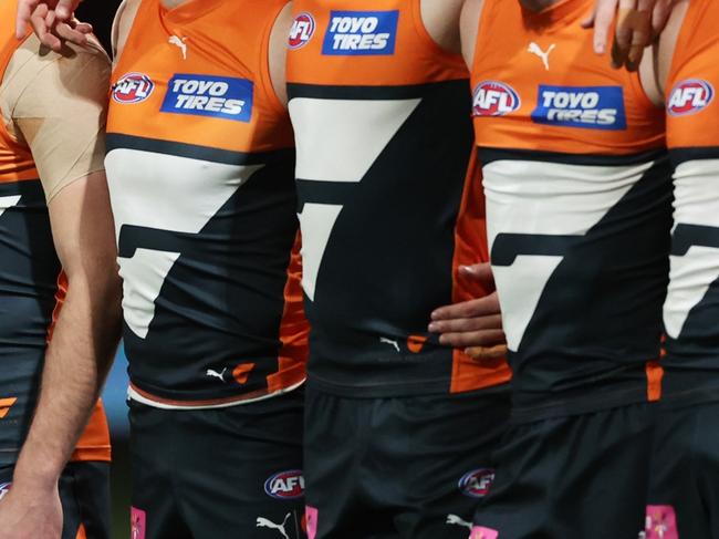 SYDNEY, AUSTRALIA - SEPTEMBER 14:  The Giants line up for the welcome to country and national anthem ceremony during the AFL First Semi Final match between GWS Giants and Brisbane Lions at ENGIE Stadium, on September 14, 2024, in Sydney, Australia. (Photo by Matt King/AFL Photos/via Getty Images)