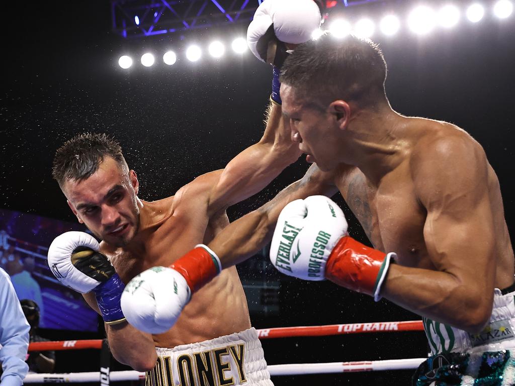 Andrew Moloney (L) and Joshua Franco (R) exchange punches.