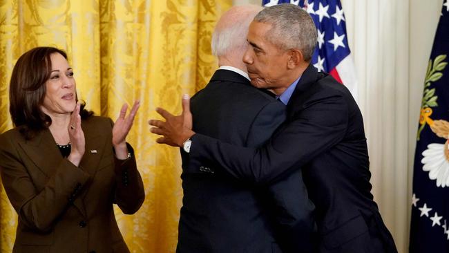 US Vice President Kamala Harris applauds as US President Joe Biden and former president Barack Obama embrace prior to delivering remarks on the Affordable Care Act and Medicaid in April 2022. Picture: AFP