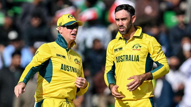 Steve Smith talks tactics with Glenn Maxwell during the ICC Champions Trophy victory against England in Lahore on February 22. Picture: AFP