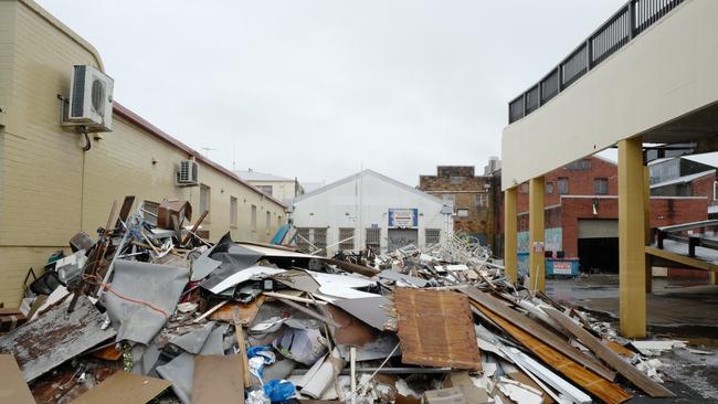 Debris sits piled up outside businesses affected by the recent floods in Lismore on March 28, 2022. (Photo by James D. Morgan/Getty Images)