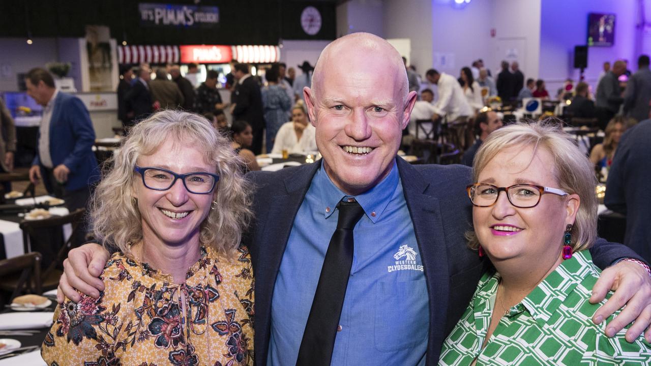 Rhonda Hannant (left) and Deb Green with Tony Coonan at the TRL awards night at Clifford Park Racecourse, Friday, September 8, 2023. Picture: Kevin Farmer