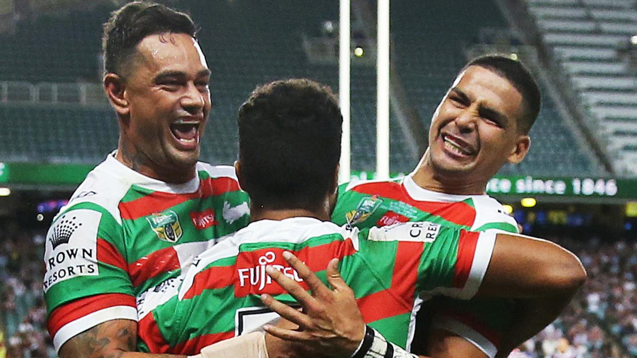Rabbitohs John Sutton and Cody Walker celebrate with Robert Jennings after a try.