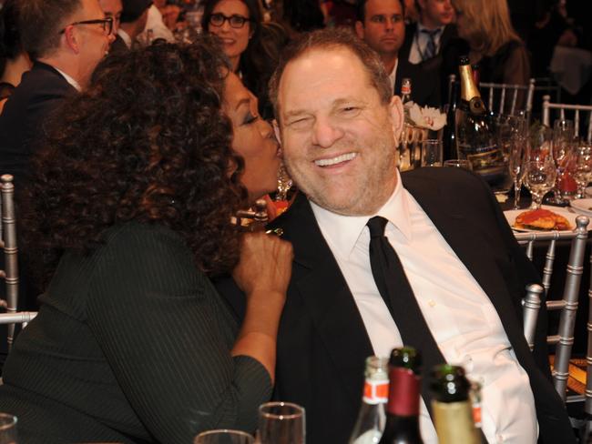 Oprah Winfrey and Harvey Weinstein get chummy at the Critics’ Choice Movie Awards in 2014. Picture: Kevin Mazur/WireImage