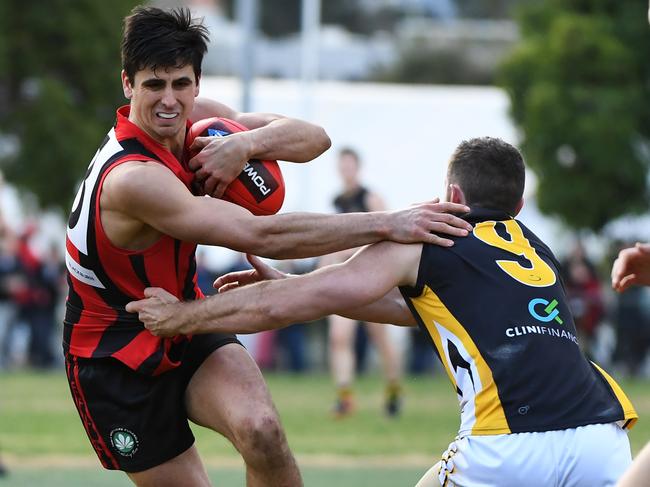 Jake Hammod (left) of Blackburn is seen in action during the EFL match at Morton Park, Blackburn, Melbourne, Saturday, August 11, 2018. Blackburn v Balwyn. (AAP Image/James Ross) NO ARCHIVING