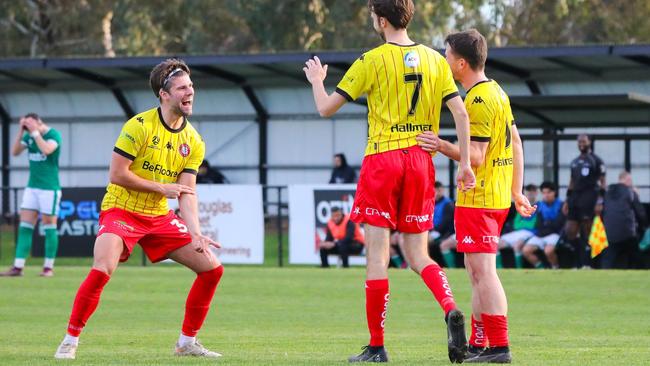 Caroline Springs George Cross players celebrate a goal. Picture: Matt Morden