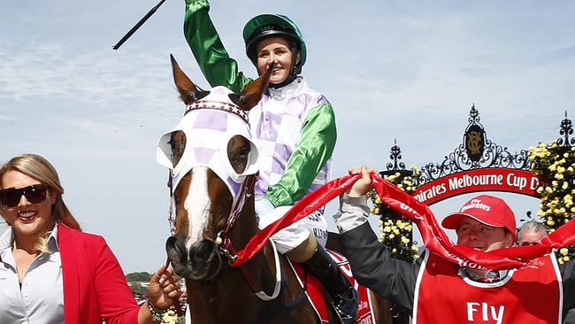 Michelle Payne celebrates her Melbourne Cup win on Prince Of Penzance. Picture: Colleen Petch