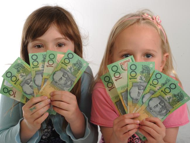 Young children posing for Your Money cover.