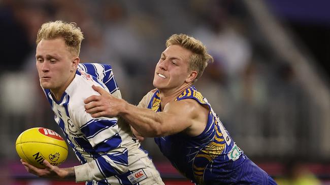 Jaidyn Stephenson tries to handball under pressure.