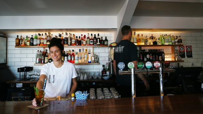 Venue manager Tiana Campagna serves up a drink in the renovated concession stand, which has been turned into a bar. Picture: AAP IMAGE/Sue Graham