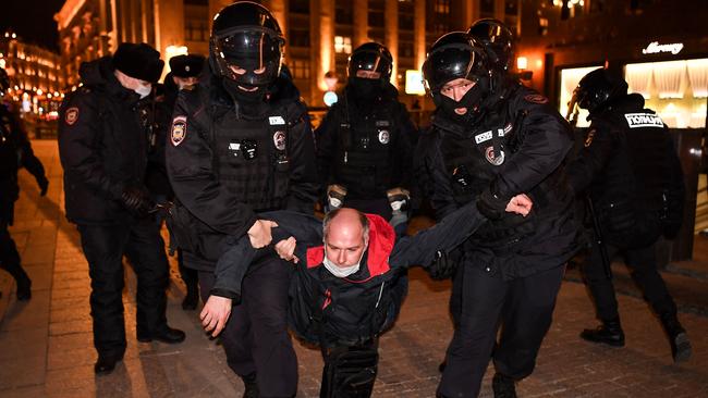 Police officers detain a man during a protest against Russia's invasion of Ukraine in central Moscow on March 3. Picture: AFP