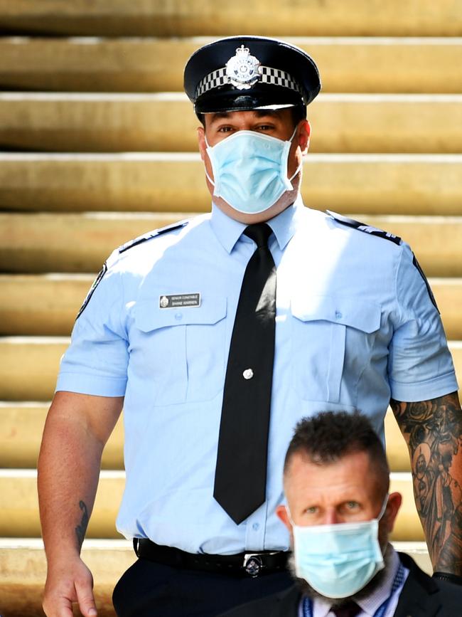 Constable Zachary Schembri &amp; Constable Shane Warren (pictured) leave the Townsville Courthouse after giving evidence at an inquest. Pictured with Queensland Police Union representative. Picture: Alix Sweeney