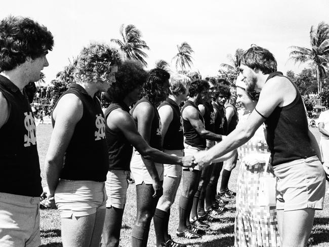 The Queen inspects the St Mary's football team at Gardens Oval with Ray Buckley escorting her, on the right. Picture: NT News staff photographer.