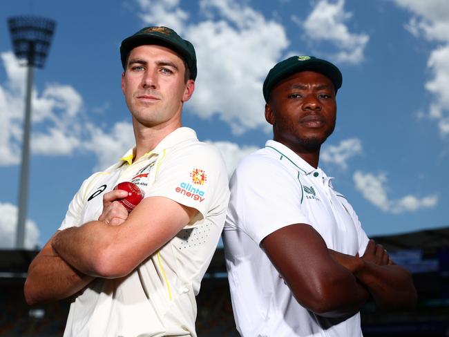 BRISBANE, AUSTRALIA - DECEMBER 16: Pat Cummins of Australia and Kagiso Rabada of South Africa pose at The Gabba on December 16, 2022 in Brisbane, Australia. (Photo by Chris Hyde/Getty Images)